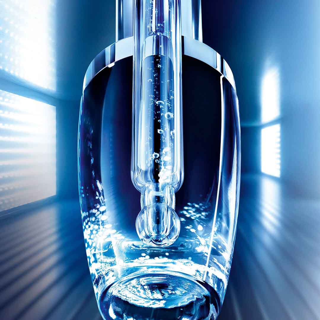 Close-up of Lancome Advanced Genifique serum dropper with microbiome formula